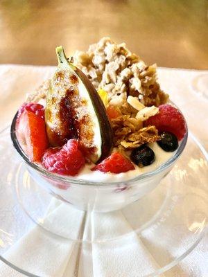 Breakfast yogurt parfait with fresh fruit and fig brûlée