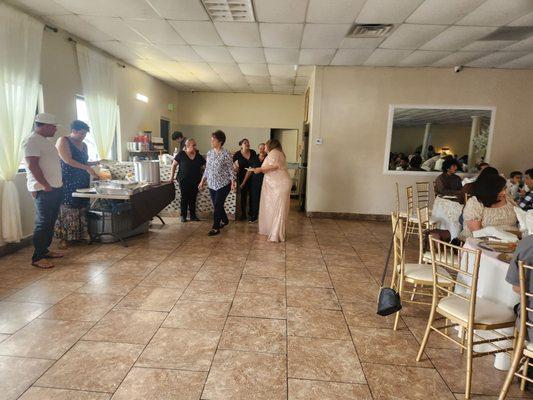 Once you enter the hall, to the left was the mini bar and where food was at