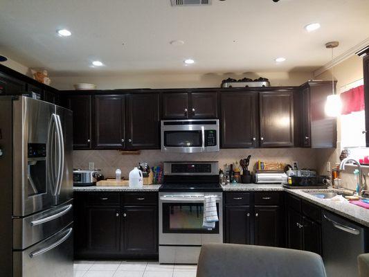 Removed the old fluorescent lighting and installed New recessed lighting in our kitchen.  Using dimmable LED lighting. Total transformation