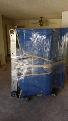 Upright piano blanket shrink wrap well protected professional movers no amateurs