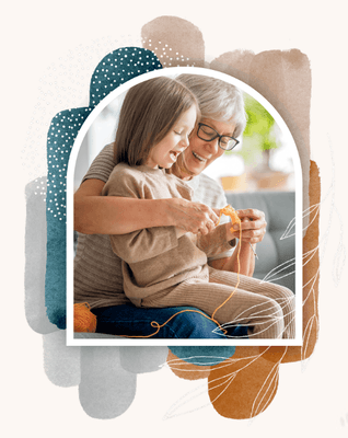 Grandmother and granddaughter crafting together.