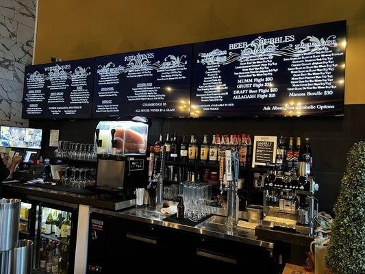 Bar area. Drink Menu on the screens on top.