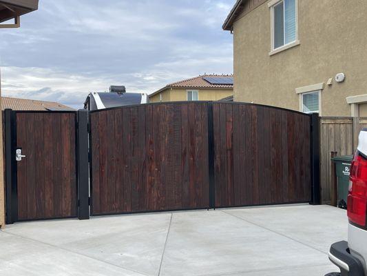 Residential, Dual swing driveway gate, with oil base stain slats.