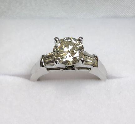 14K white gold engagement ring created by using a family members diamonds.