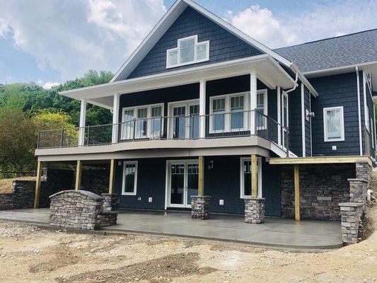 Veneer stone, patio, wood burning fire pit, with gas log lighter. Right on the shore of Findley Lake.