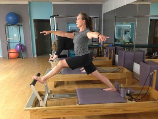 Pilates exercise - Standing Lunge - enhances flexibility and balance.