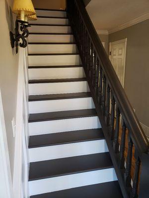 This staircase was from the 1800s dark stain customer wanted to mordonnized them and that's what they got.