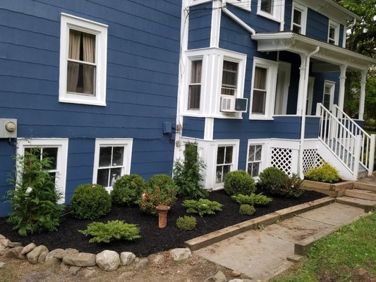 Simple but gorgeous design/ layout and install on this new mulch bed with new shrubbery