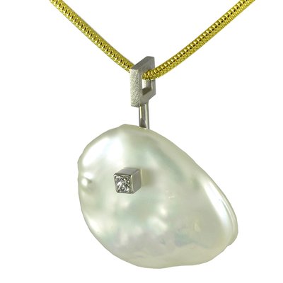 one-of-a-kind kesha pearl and diamond pendant.