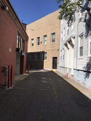 Alleyway behind the courthouse you can park on Chelsea Street lots of parking there