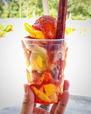 Mangoneada: Mango sorbet, fresh chunks of Mango, chamoy sauce and tajin.