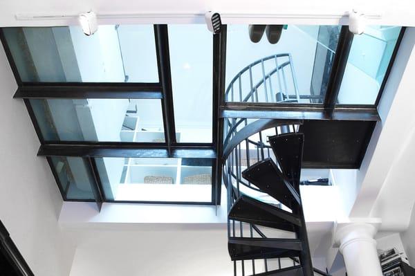 a glass floor and stair for a city apartment