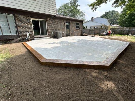 Concrete patio with textured and stained borders