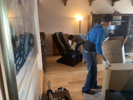 Chair being assembled during delivery