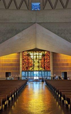 inside facing front entrance, jesus glowing as you exit the church.