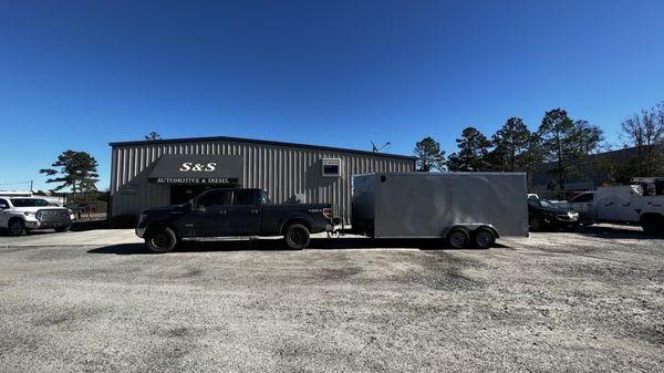 My truck and trailer broken down in front of their shop