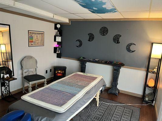 Relaxing therapy room complete with infrared chakra mat, to help with balance and alignment.