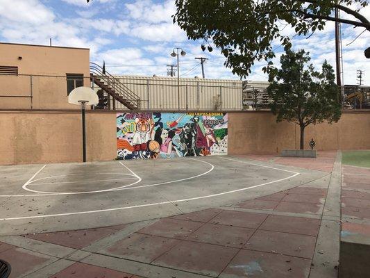 Play some ball with a nice mural.