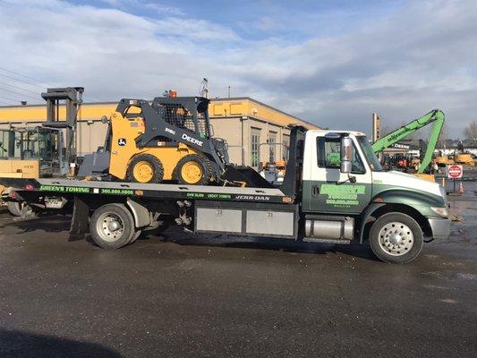 Small equipment mini excavator and tractor transport.