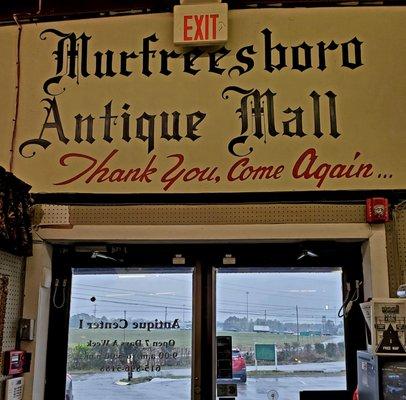 March 2021: The former name of this 1970 antique store-- they've allowed the former sign to remain