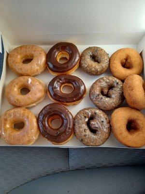 $11.90, tax included for mix dozen. Plain glazed, chocolate cover glazed, blueberry cake glazed, and plain cake.