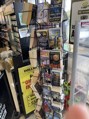 The spin rack of paperbacks near the door at this Dollar General. They were mostly recent fiction and all books were priced at $3.