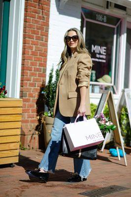 One of our models, Kim, walking outside of our Main Street location in Davidson, North Carolina.