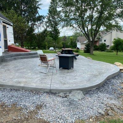 Step up your BBQ game with a custom concrete patio to fit your space!