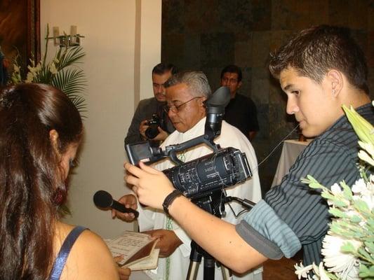 BTS Professional Photo Of Our Cameraman Recording The Bride and Groom Reading Their Vows In 2011.