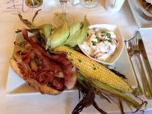 All American meal - beer-braised bacon brat, corn-on-the-cob, dill potato salad