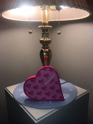 Heart shaped candy box with a period lamp