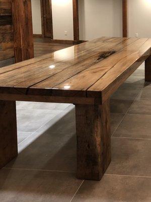 Handcrafted long wood dining table and seating.