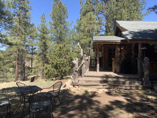 Cabin on the Hill Log guest suite with large fenced yard for pets.