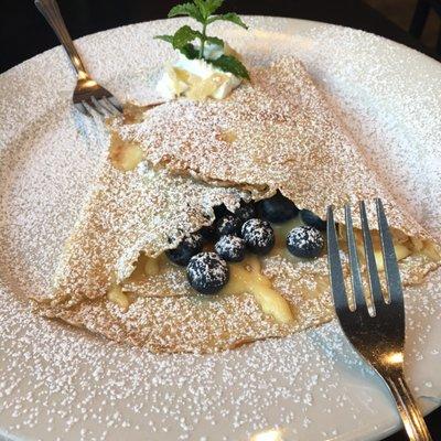 An amazing Lemon Blueberry crepe topped with fresh whipped cream and hand made candies lemon peel. Absolutely delicious!