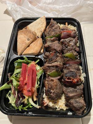 Ribeye kabobs, pita, salad, rice pilaf