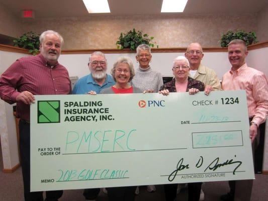 Spalding Insurance Agency holds an annual golf tournament to raise funds for the local emergency relief fund.