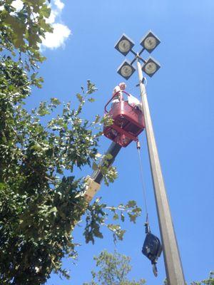 Light Pole retrofit with LED installation by Mitch Morgan's electric and Flags and Poles in Dallas. 2014