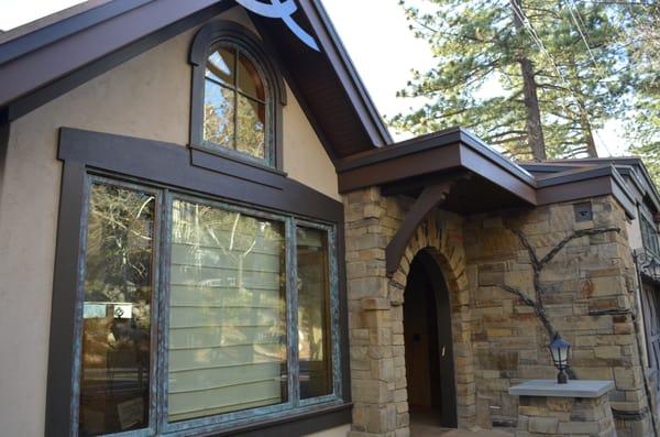 Finished exterior... note the custom masonry arched entry.