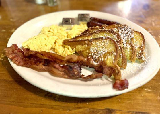 French toast with bacon, sausage and eggs.