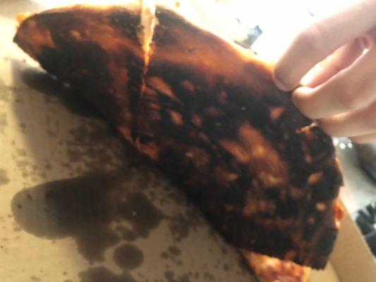 burnt ass pizza harder than rocks