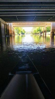 Under the highway.