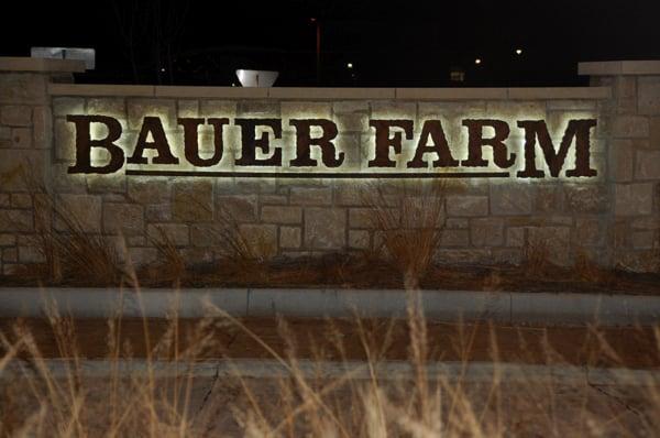 Halo Lit letters in Lawrence, KS. Reverse lit and mounted on stone wall.