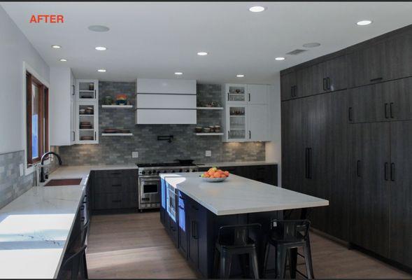 Kitchen done in Bellmont Cabinetry textured laminates, painted blue and white. Cambria Quartz countertops, CopperSmith hood.