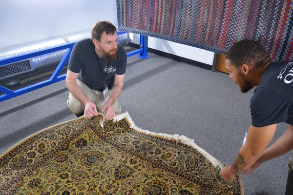 Rugs are given a thorough inspection.