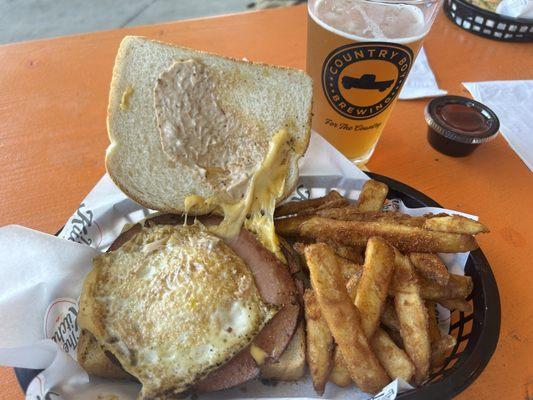 Bologna sandwich with an egg and grape fries too