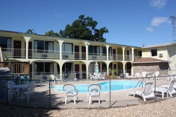 Outdoor Pool and Courtyard with tables and BBQ grills