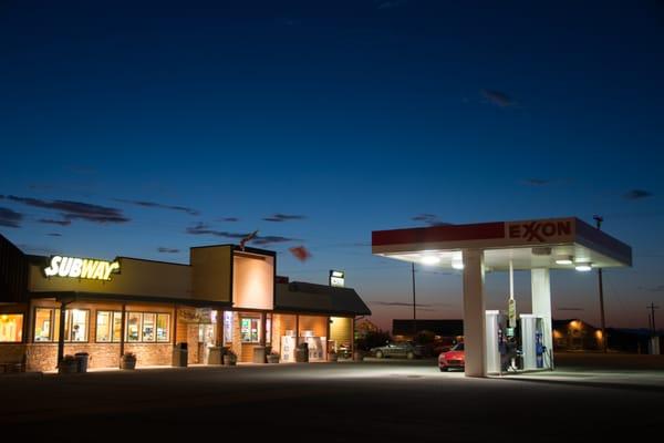 The motel "front desk" is the cashier at the convenience store.