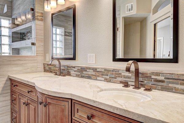 Westbrook Remodeling & Painting bathroom remodeling project. Custom tile backsplash, countertops, custom cabinets, and bathroom fixtures.