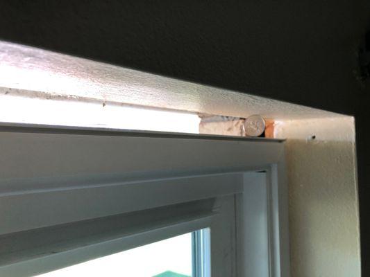 1 inch gap above all windows.  At first nothing filling the gap.