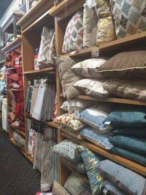 Nice selection of pillows and curtains